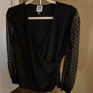 Elegant Black Wrap Top with Sheer Polka Dot Sleeves